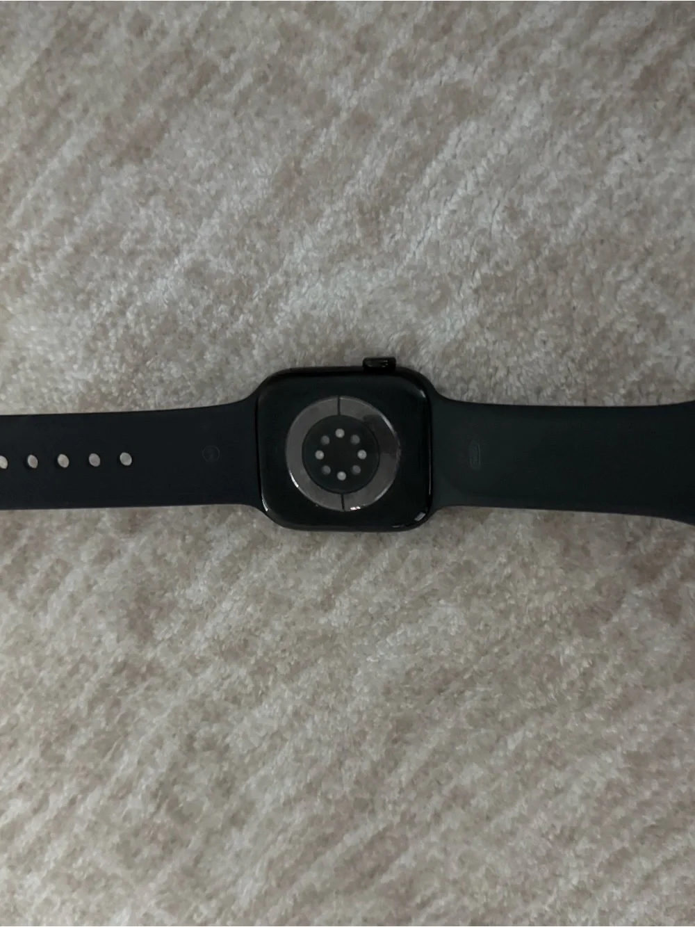 Apple Watch Series 11. GPS. 44mm Jet black aluminum case with black sport band.
